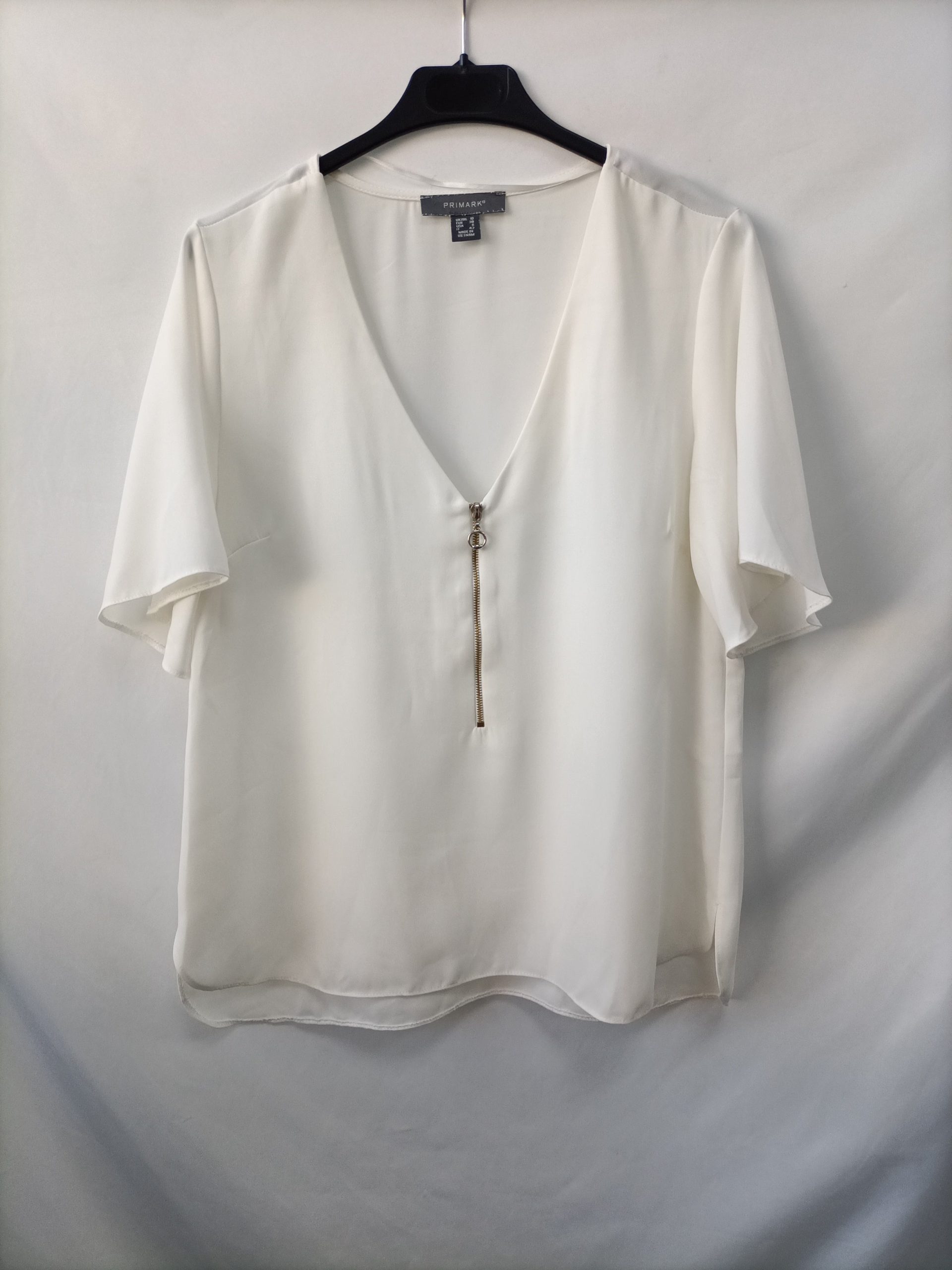 PRIMARK. Blusa blanca cremallera T.38