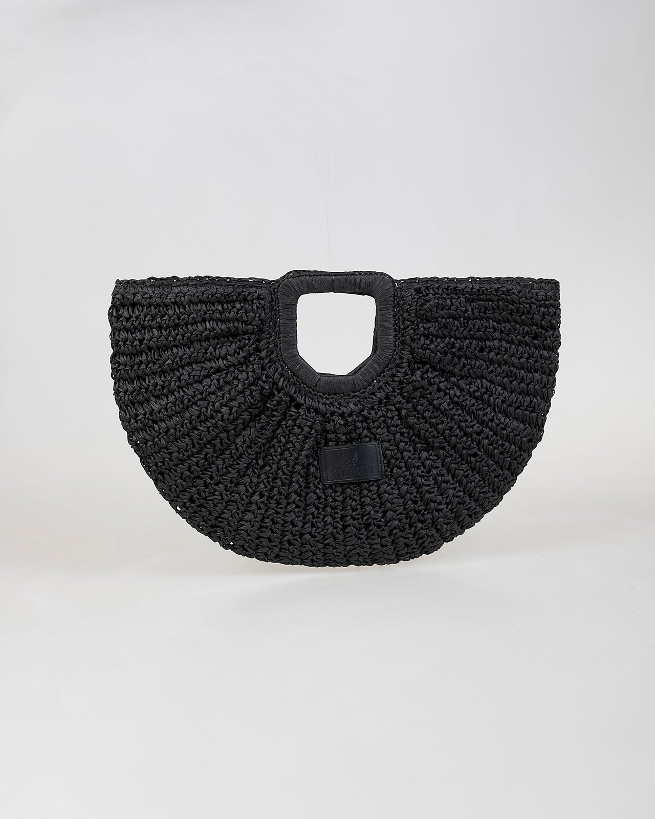 Bolso media luna trenzado