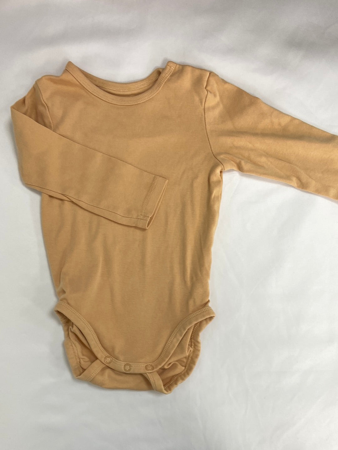H&M.Body mostaza pastel 9-12 meses
