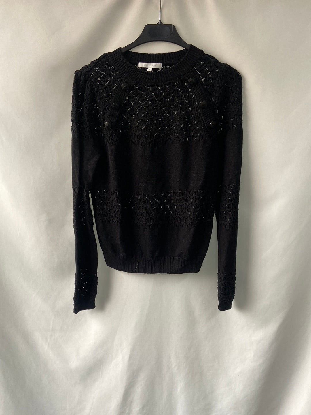 SCALPERS.Jersey negro troquelado T.s